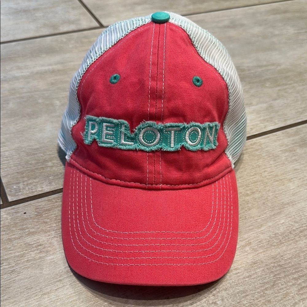 NWOT Peloton trucker hat, coral and green colors